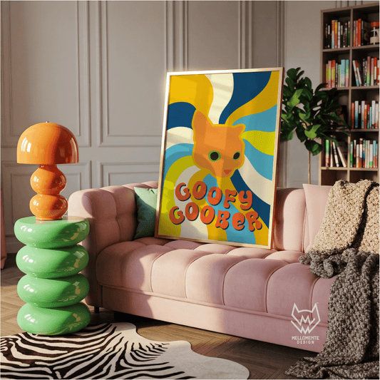 Colorful room with a pink couch, orange lamp, and a print of an orange cat and text "Goofy Goober" Framed art shown as display suggestion.