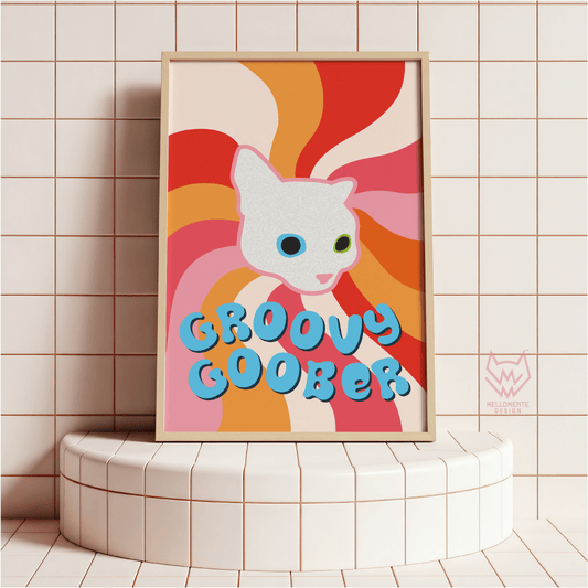 Framed artwork with a cartoon cat face and 'Groovy Goober' text on a tiled wall. Framed art shown as display suggestion.