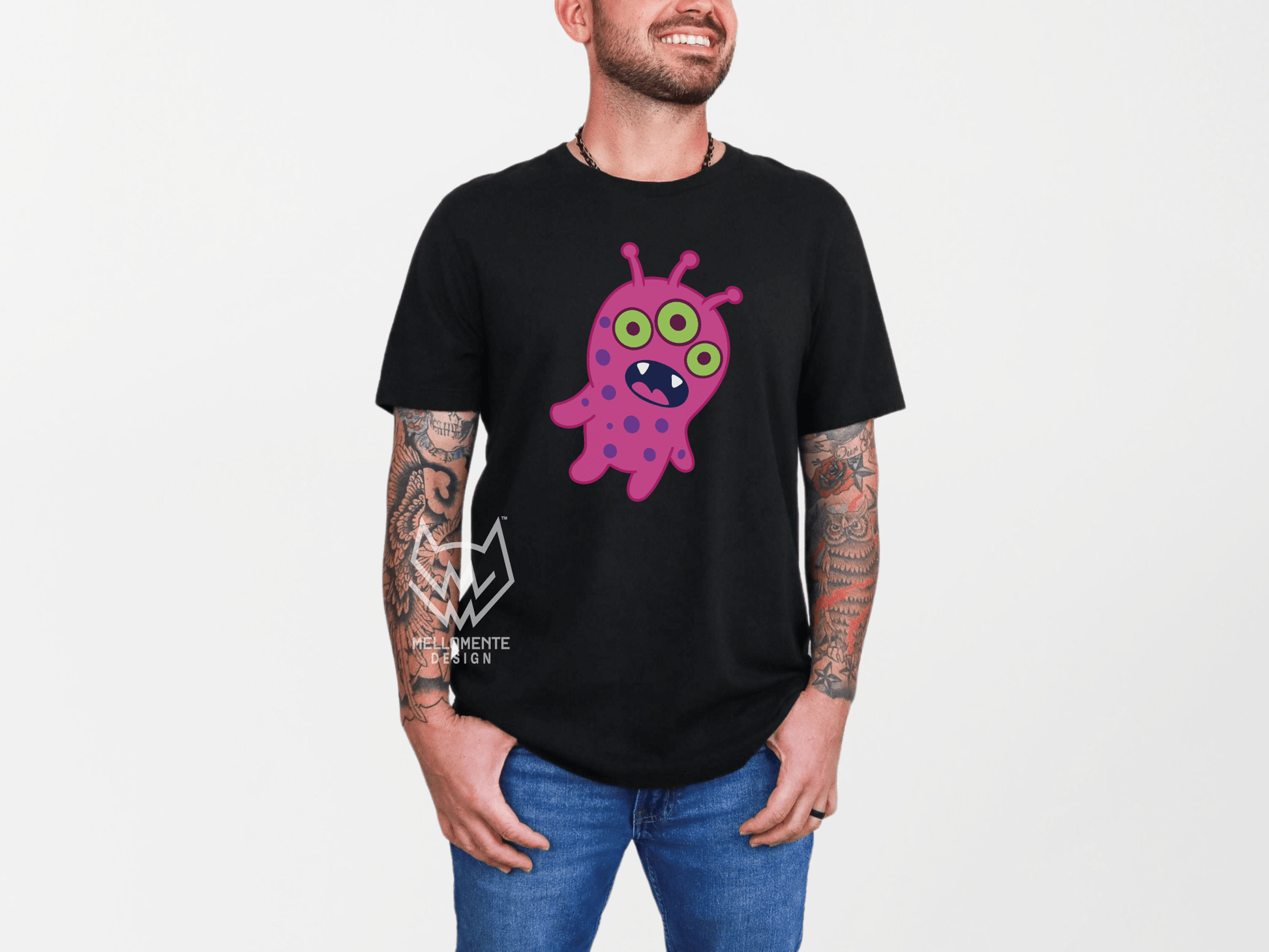 Man wearing a Black shirt featuring a pink alien creature.