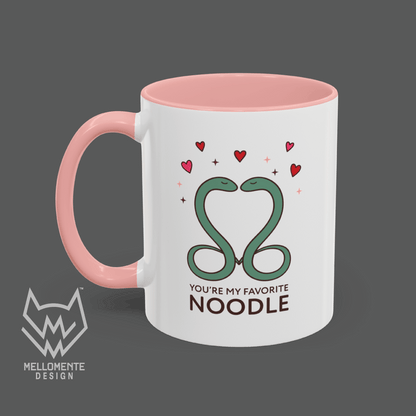 Mug with pink handle and interior featuring a cute valentine themed snake design captioned: "You're my favorite noodle."