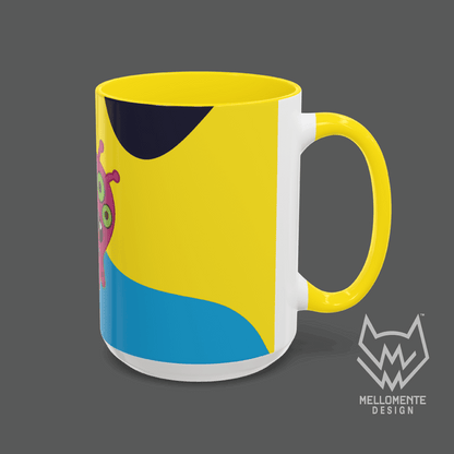 Ceramic mug with yellow interior featuring colorful artwork with a pink alien creature on a solid background.