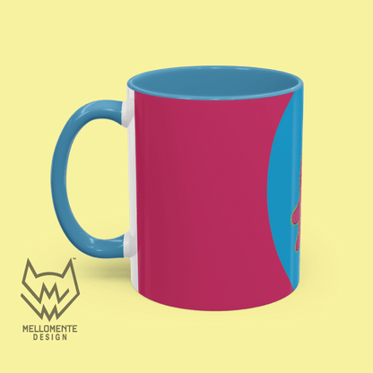 Ceramic mug with blue interior featuring colorful artwork with a pink alien creature on a solid background.
