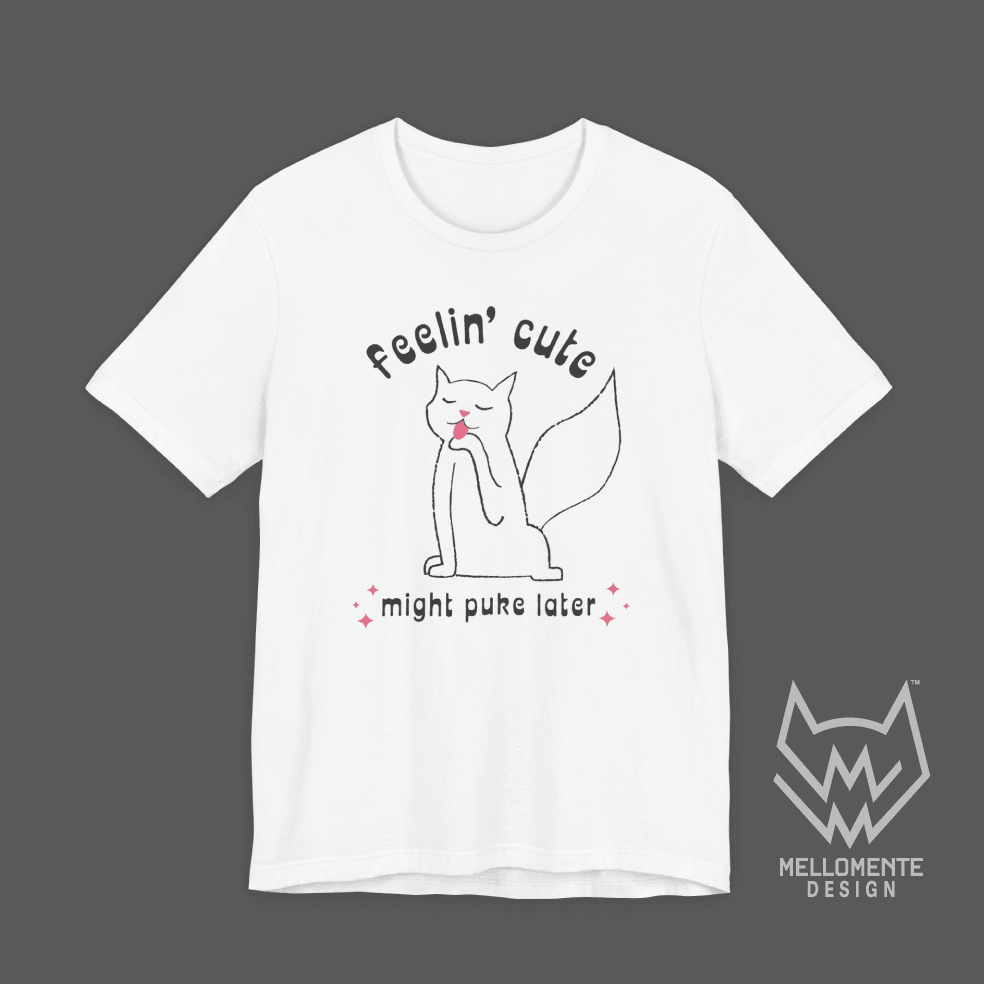 White t-shirt with a cat graphic and text on a solid background.
