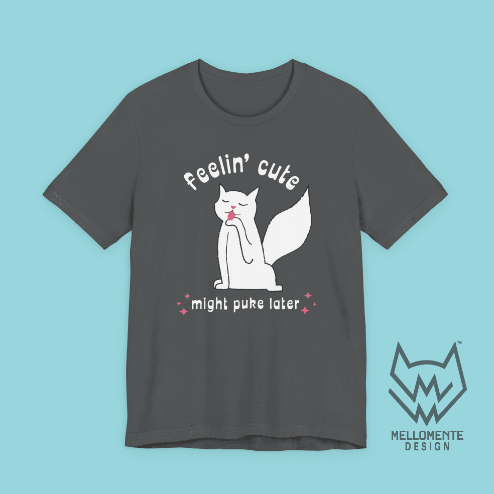 Gray t-shirt with a cat graphic and text on a solid background.