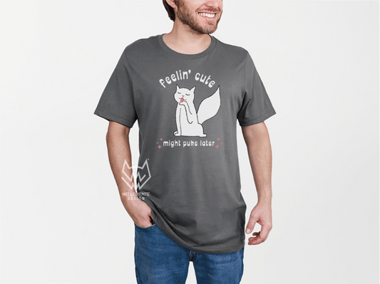 Man wearing a gray t-shirt with a white cat graphic and text on a white background