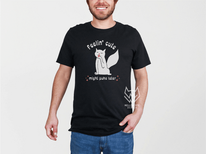 Person wearing a black t-shirt with a white cat graphic design and text on a plain background