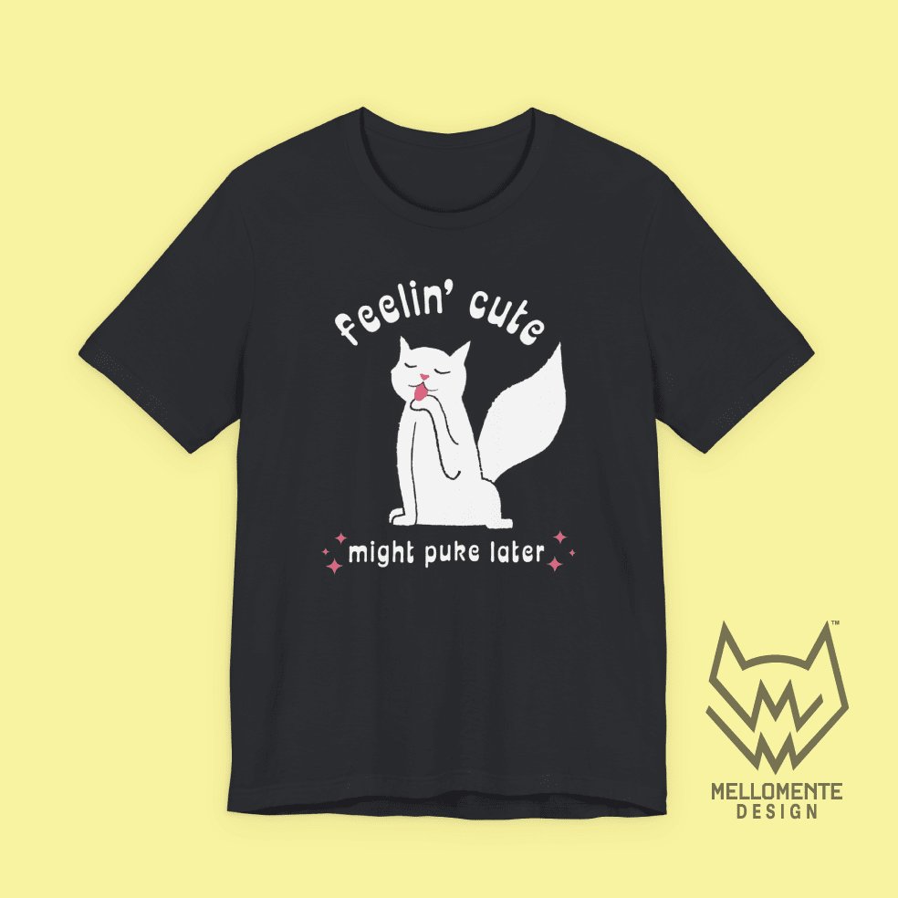 Black t-shirt with a cat graphic and text on a solid background.