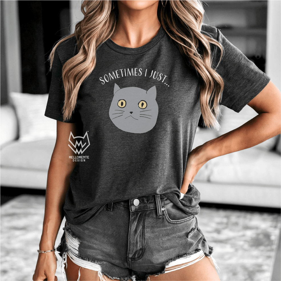 Woman wearing a dark grey t-shirt with a cat graphic and text in a living room.