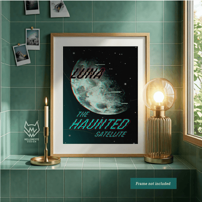 Luna - The Haunted Satellite moon poster displayed in wooden frame on green tiled wall with candle and lamp decor.