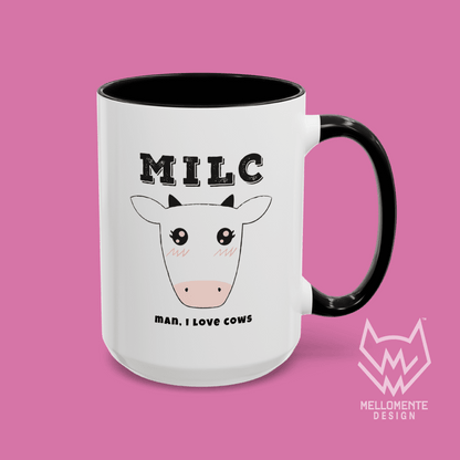 White mug with black interior featuring cow illustration and text 'MILC - Man, I love cows' on a solid background.