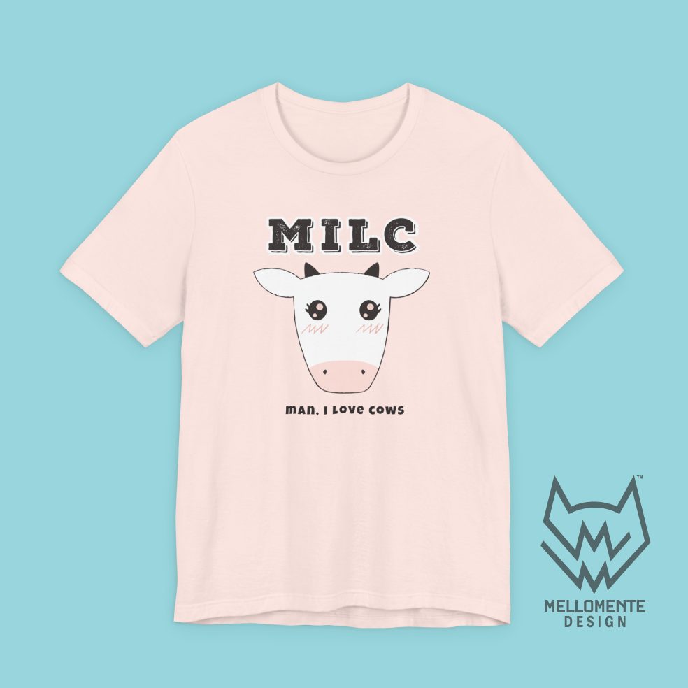 Pink t-shirt with a cow graphic and 'MILC - Man, I love cows' text on a solid background.