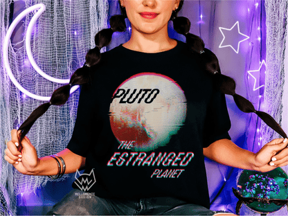 Woman wearing a t-shirt with 'Pluto: The Estranged Planet' design in front of decorative lights.