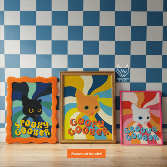 Three colorful framed artworks of cartoon cats against a checkered wall.